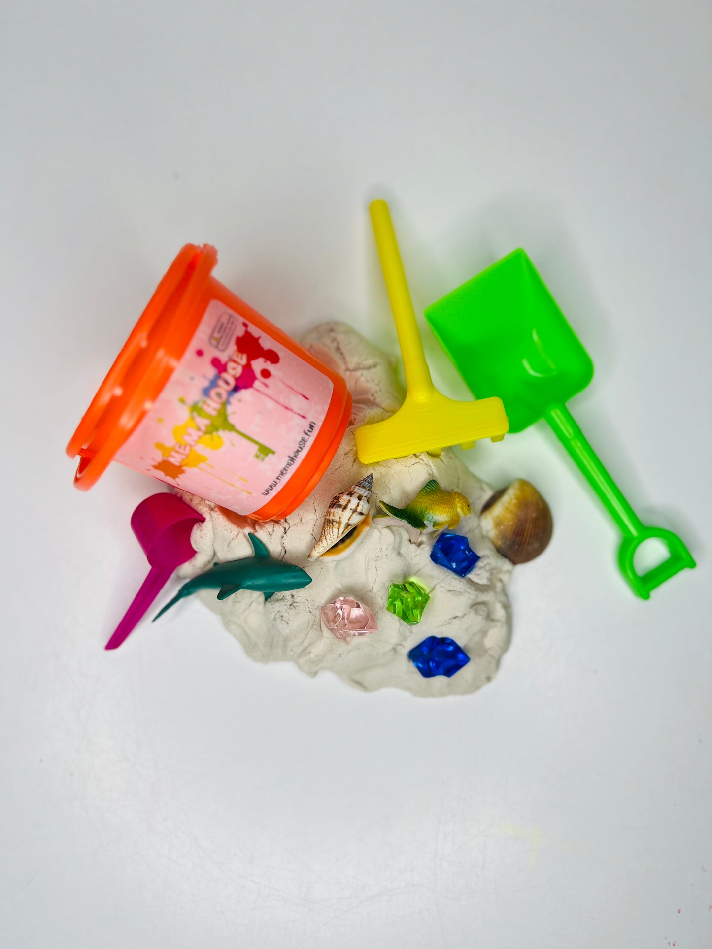 bucket of sensory sand with toys