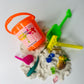 Bucket of sensory sand with toys