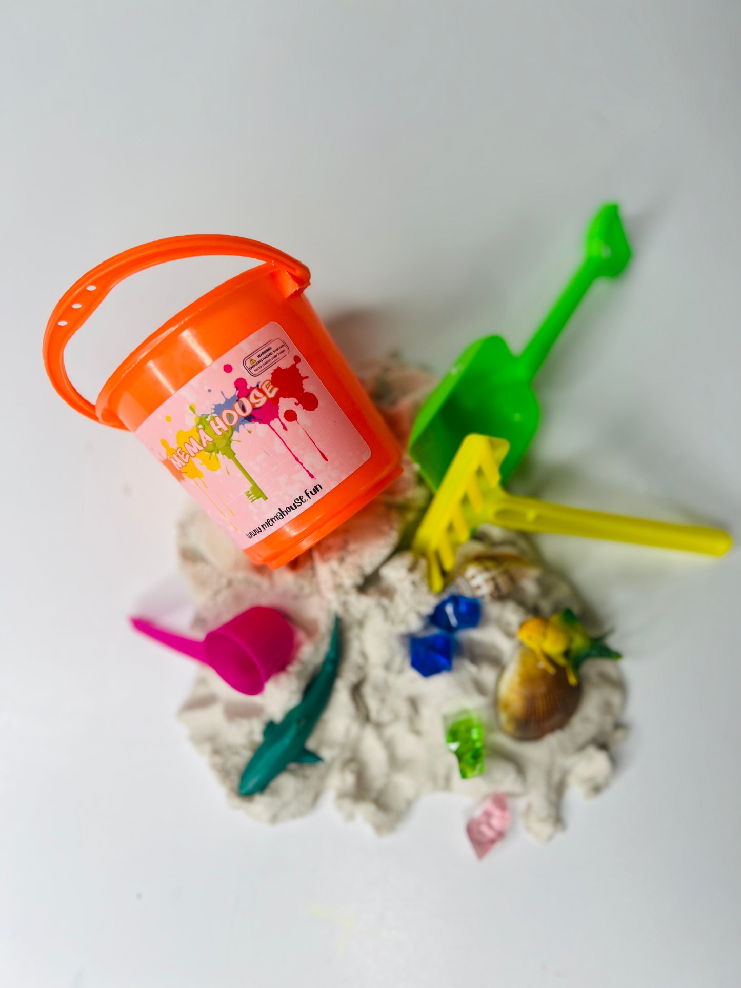 Bucket of sensory sand with toys